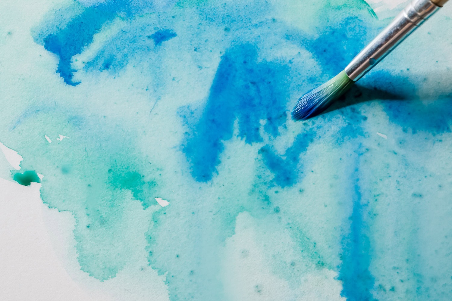 blue and green watercolor painting in progress