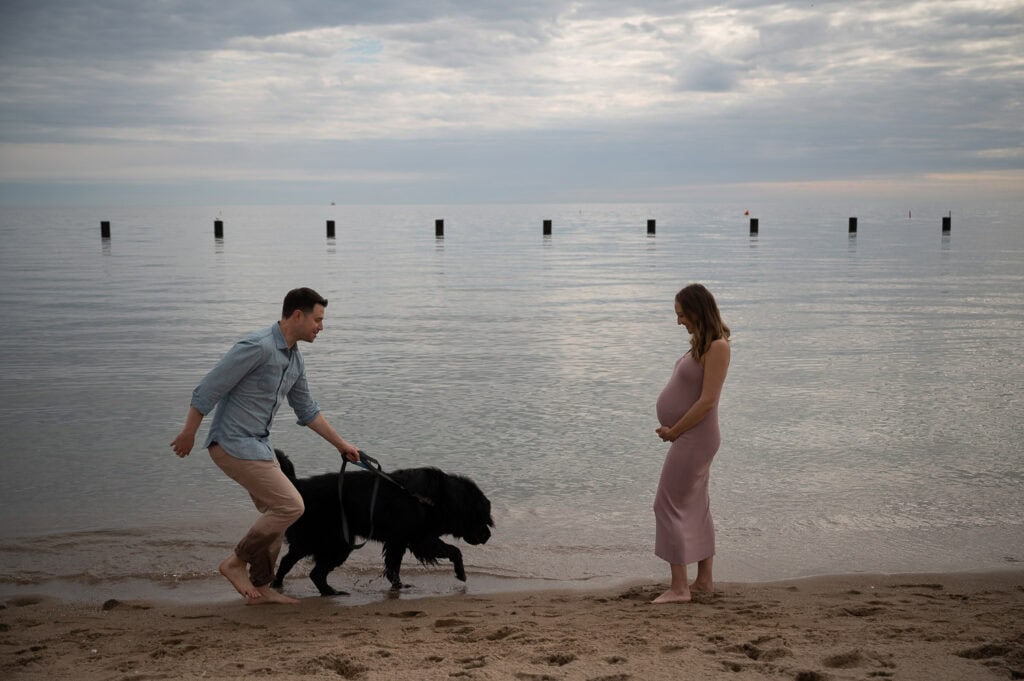 Raw image showing man and dog running towards pregnant woman