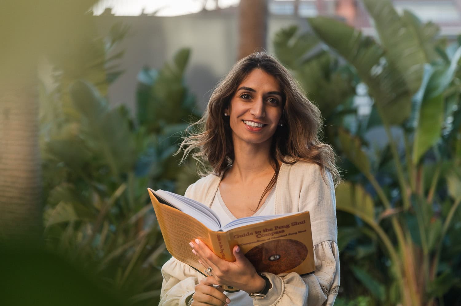 Photo of Anaeka Photography reading a Feng Shui book