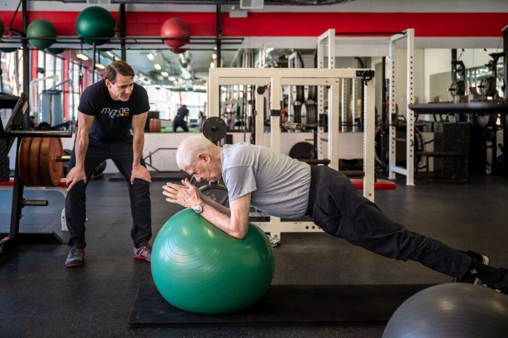 David Burnett of Finding Fitness working with client on balance ball