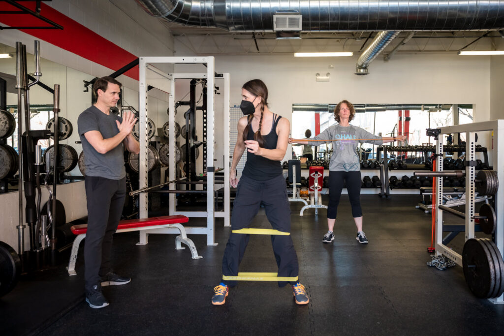 Custom stock image of David Burnett working with a client during a personal training session