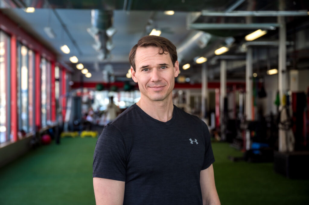 David Burnett of Finding Fitness standing with view of gym in background