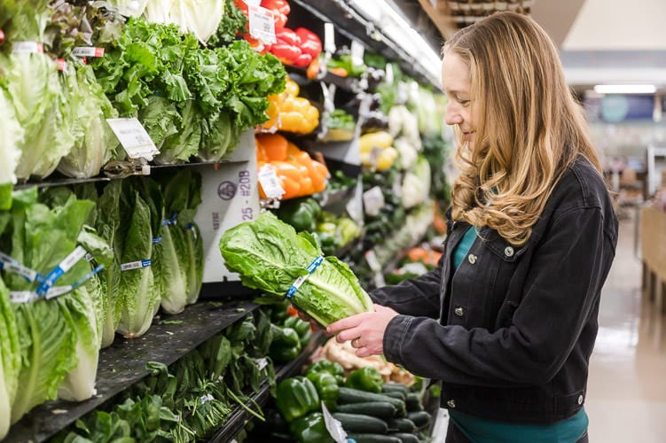 Female Nutritionist picks out vegetables at Jewel in Chicago