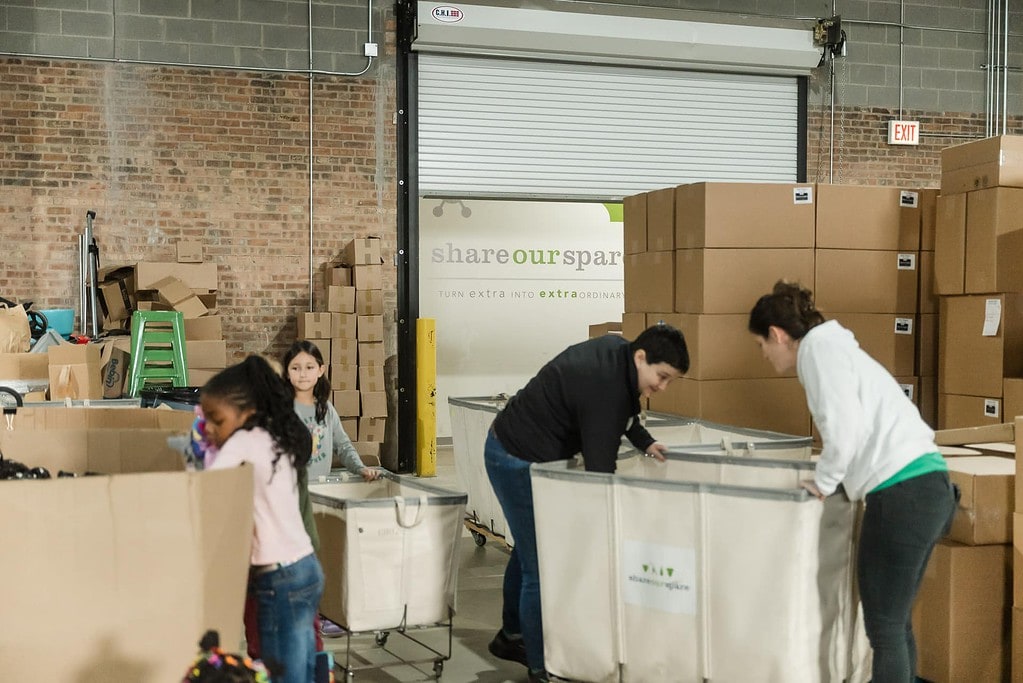 Volunteers inside the warehouse working at Share Our Spare of Chicago