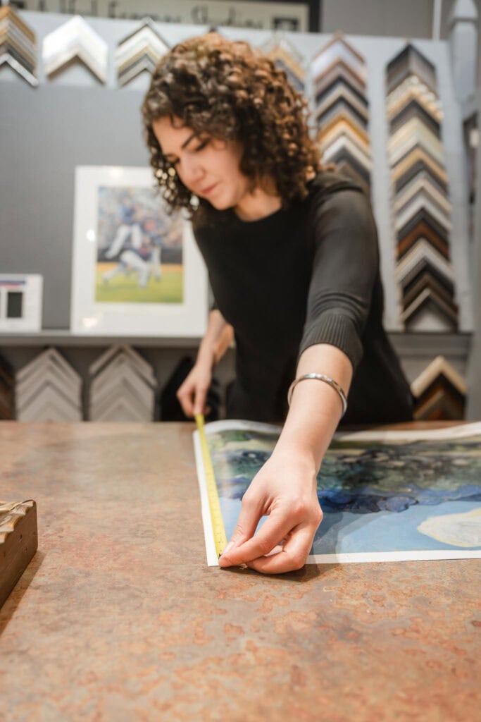 Behind-the-scenes glimpse of Hope Dye of the Artful Framer at work