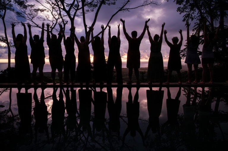A primal scream in front of a sunset backdrop in Costa Rica by a group of women attending the Reclaim Your Peace Retreat led by Heather Vickery of Chicago