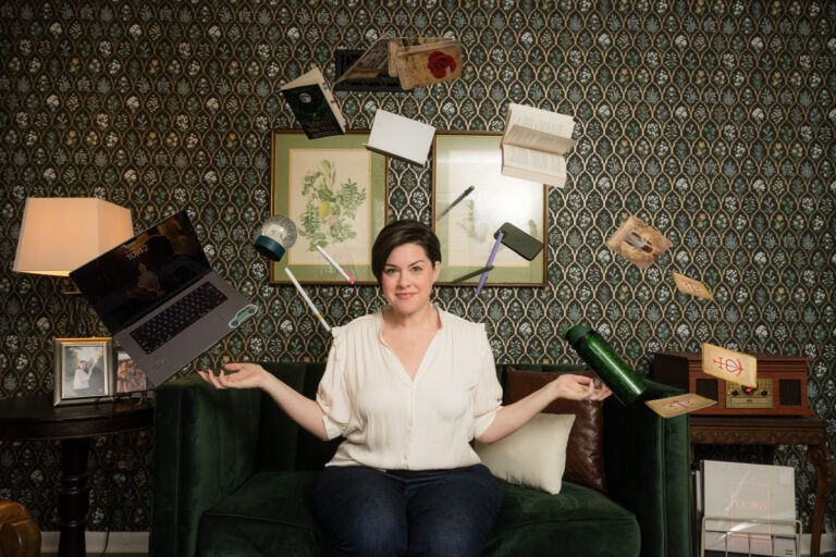 Human-made image of Katie Kastner. Showing her taming the objects flying around her as she tames the chaos and brings clarity for her clients.